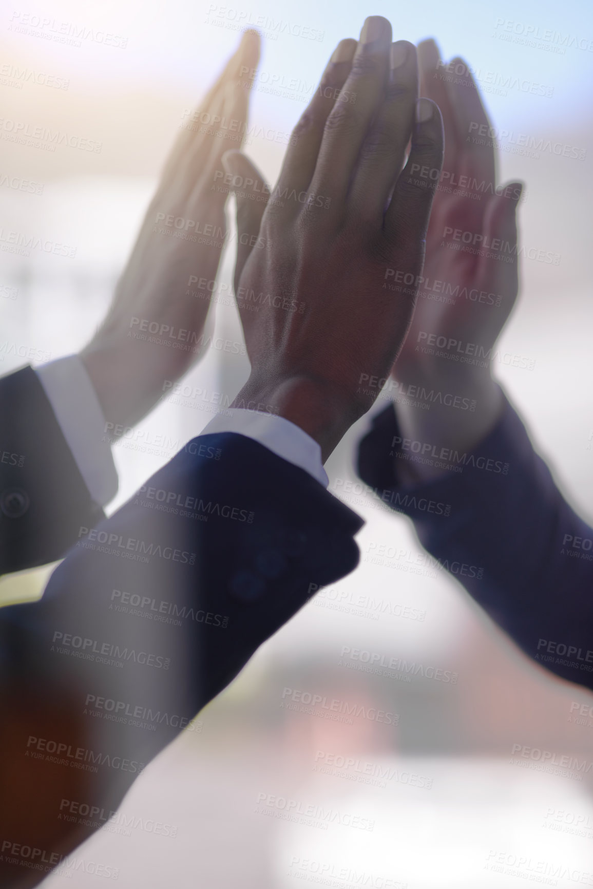 Buy stock photo Cropped shot of a group of businessmen giving each other a high five