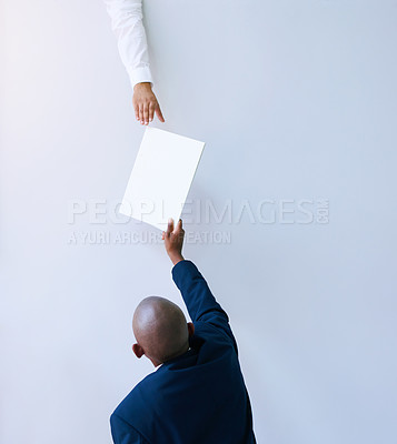 Buy stock photo Rear view, business man and passing document with hand for career, report or letter for blank paper. Young person or director with page above for paperwork, collaboration or planning on mockup  