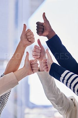 Buy stock photo Cropped shot of a group of businesspeople giving thumbs up in an office
