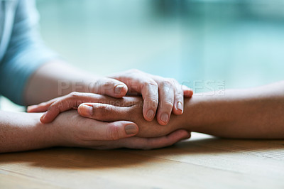 Buy stock photo Shot of two people holding hands in comfort