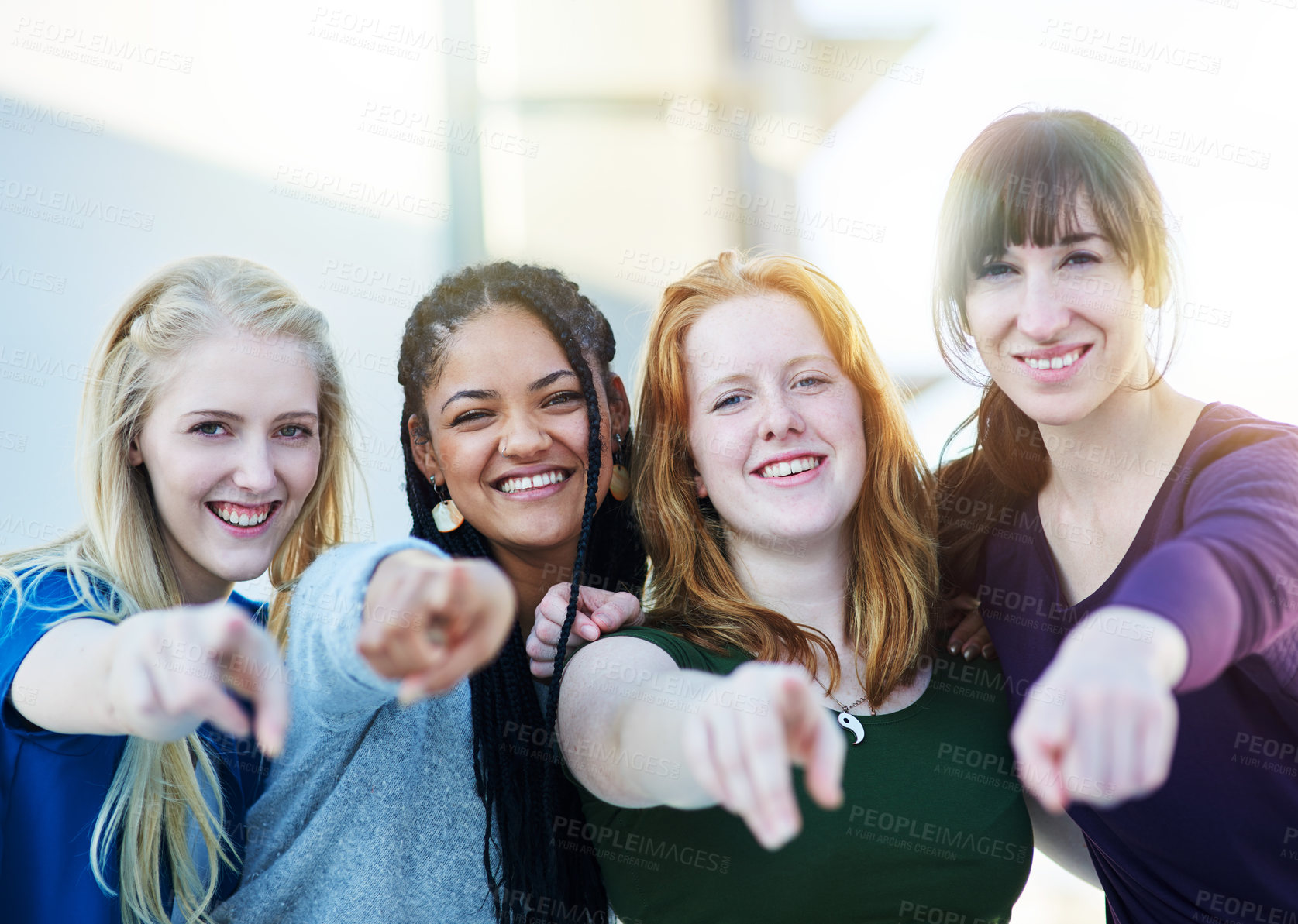 Buy stock photo Portrait of a group of women pointing their fingers forward together