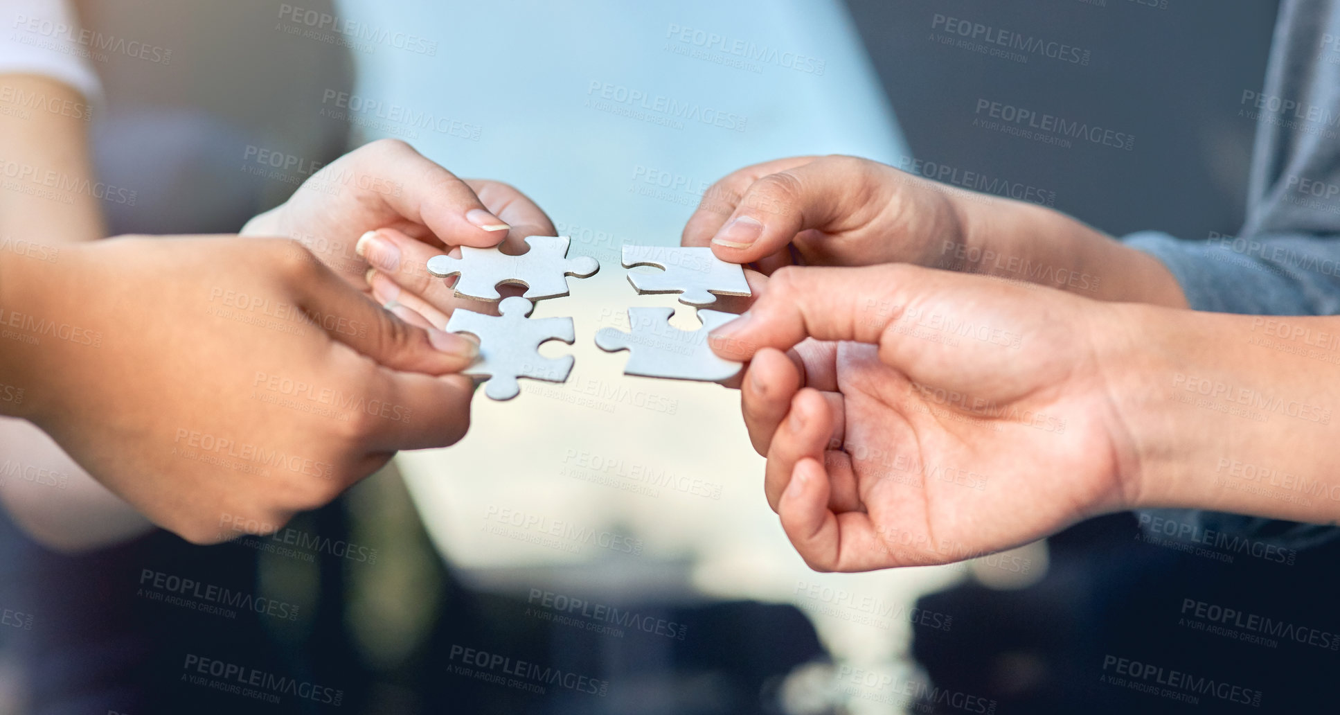 Buy stock photo Closeup of businesspeople about to put four puzzle pieces together