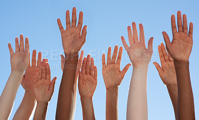 Buy stock photo Cropped shot of a diverse group of people raising their hands