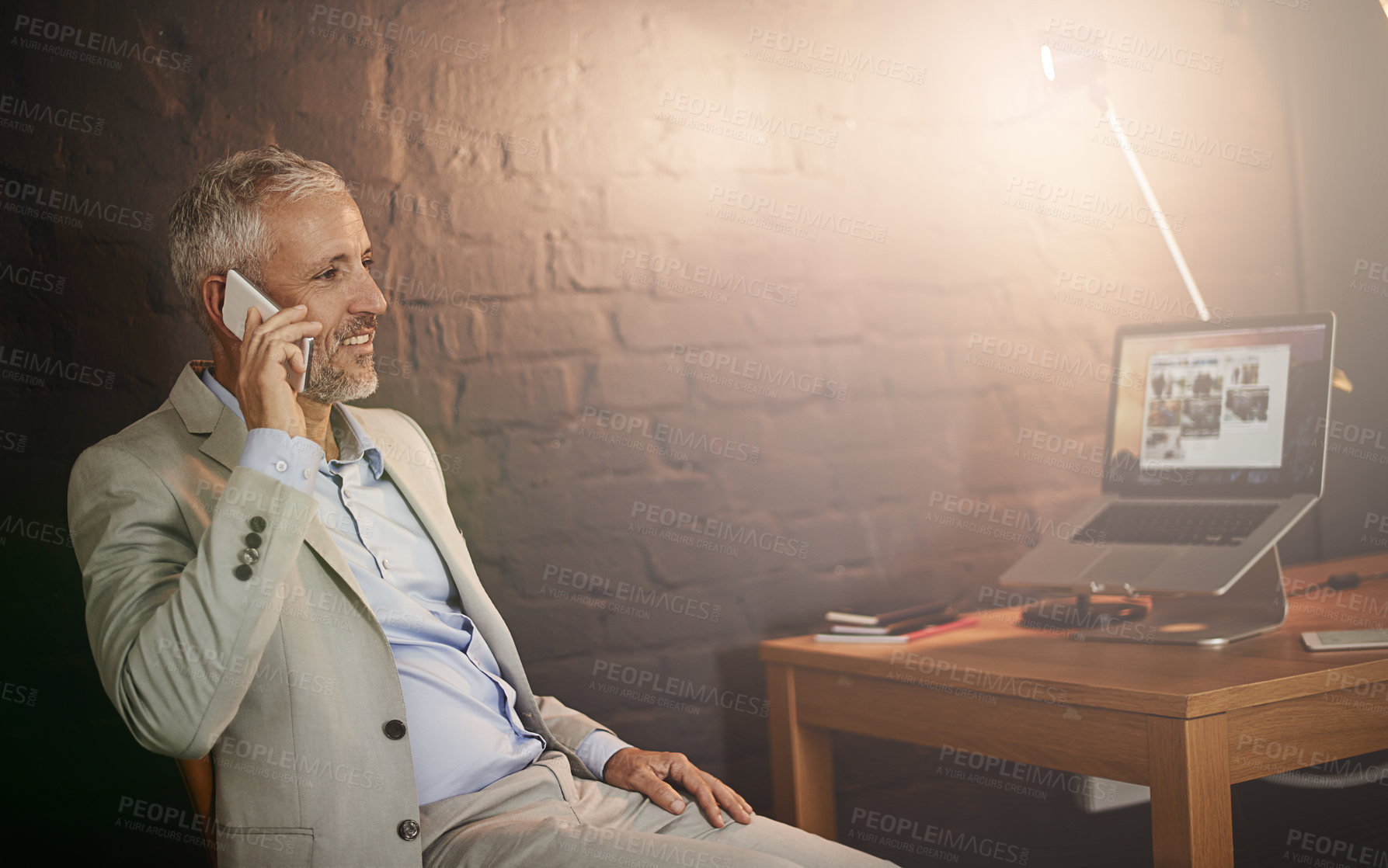 Buy stock photo Shot of a mature businessman talking on a phone