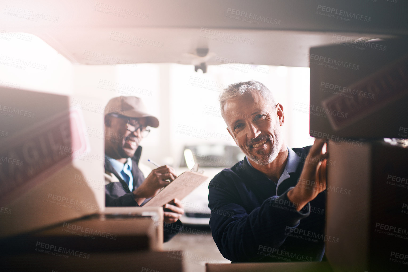 Buy stock photo Men, warehouse and loading boxes in delivery van with shipping checklist, inventory check or supply chain. Courier service, teamwork and packing cargo in vehicle for package distribution or logistics