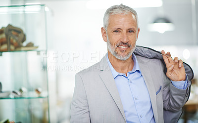 Buy stock photo Portrait of a mature man standing in a mall