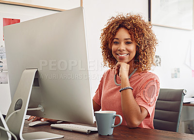 Buy stock photo Shot of a young designer working on her computer