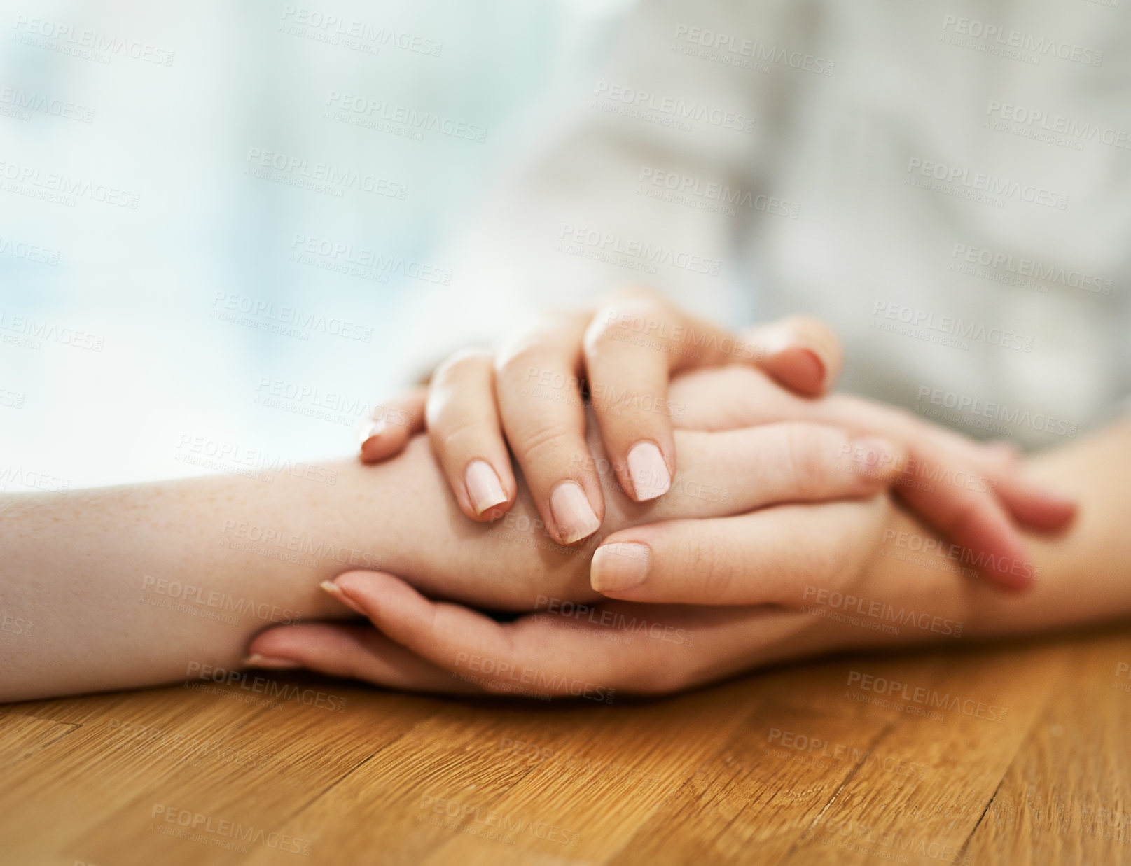 Buy stock photo Shot of two people holding hands in comfort