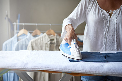 Buy stock photo Closeup of a woman ironing a shirt