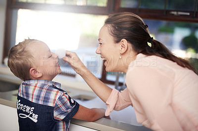 Buy stock photo Happy, parent and child in kitchen cleaning for education, development and family teamwork. Smiling, mother and kid working together for teaching, hygiene or learning healthy habits and bonding