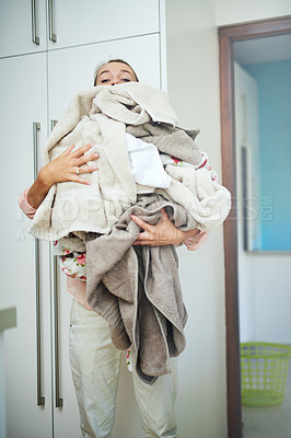 Buy stock photo Woman, laundry and clothes pile for housework or washing hygiene as apartment service, sanitary or spring cleaning. Female person, towels and stack of linen in home for chores, routine or organize