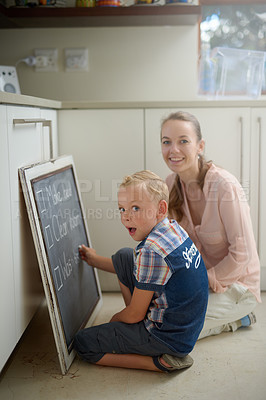 Buy stock photo Mother, child and writing chores on chalkboard for checklist, daily routine or activities at home. Parent, kid or son in surprise or shock for list, housekeeping or duty for cleanliness at house
