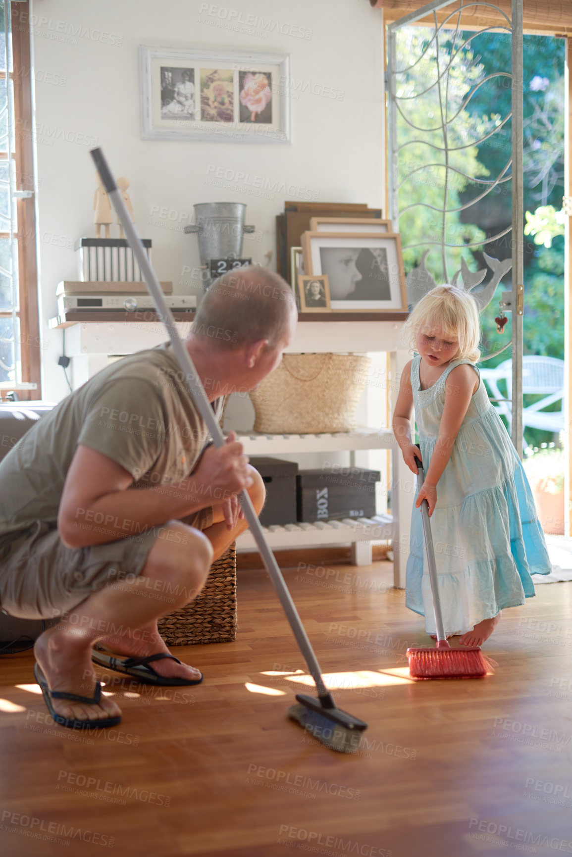Buy stock photo Father, daughter and broom for sweeping in home, helping and learn to clean for housework. Daddy, girl and bonding for hygiene or responsible housekeeping, dust and routine service for parenting