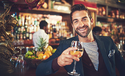 Buy stock photo Cropped portrait of a young man sitting in a bar