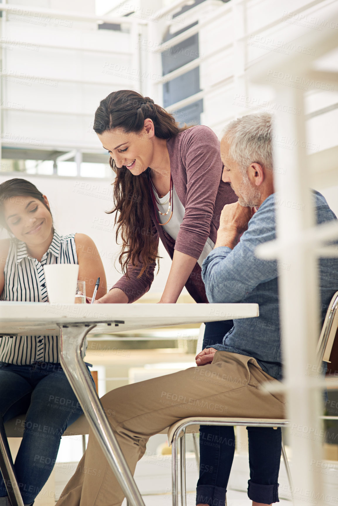 Buy stock photo Shot of a team of colleagues having a meeting in a modern office