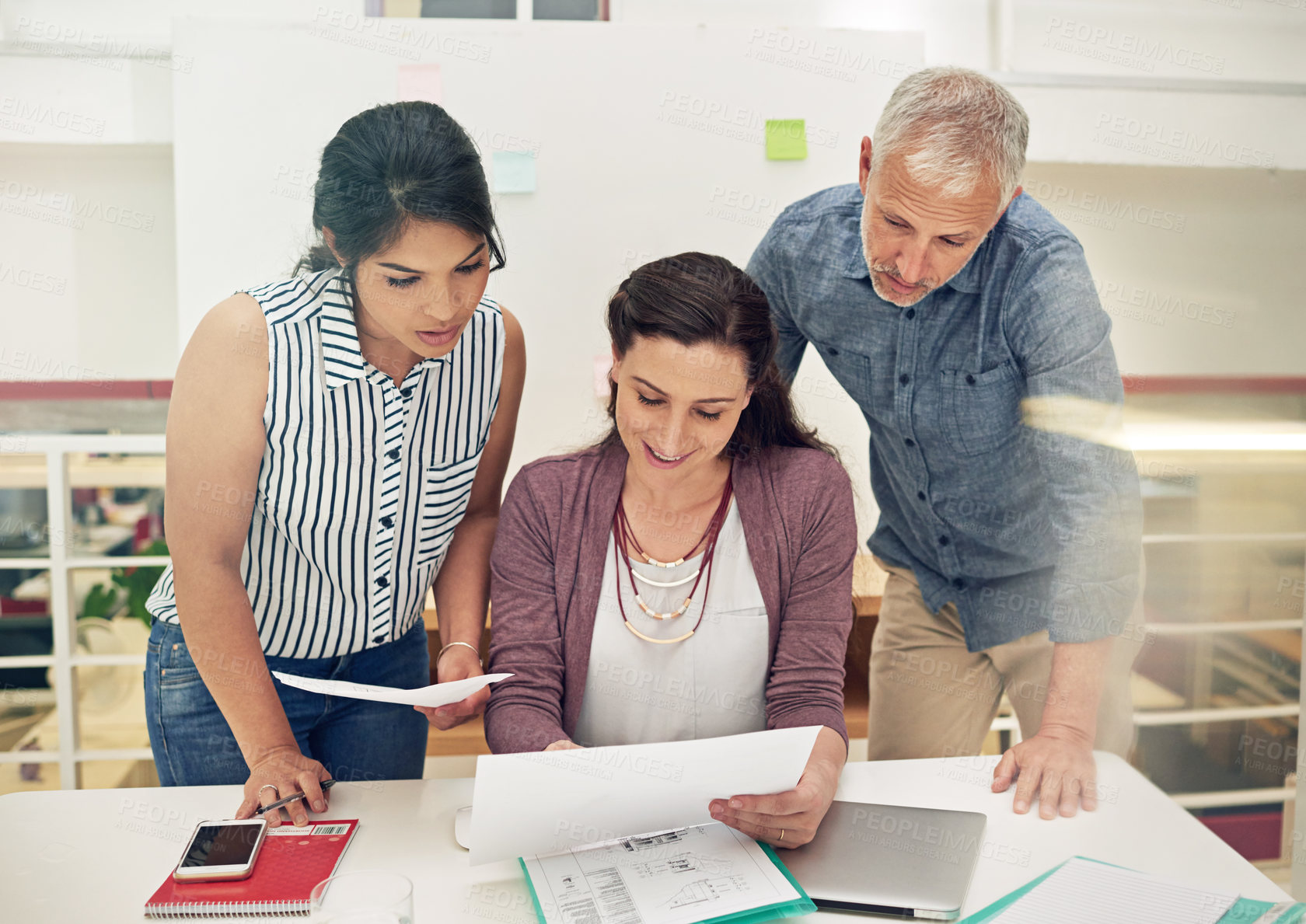 Buy stock photo Shot of a team of colleagues having a meeting in a modern office