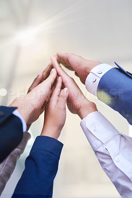 Buy stock photo Hands, high five and success with business people in office from below for support, teamwork or unity. Goals, partnership and team building with employee group in workplace for celebration of target