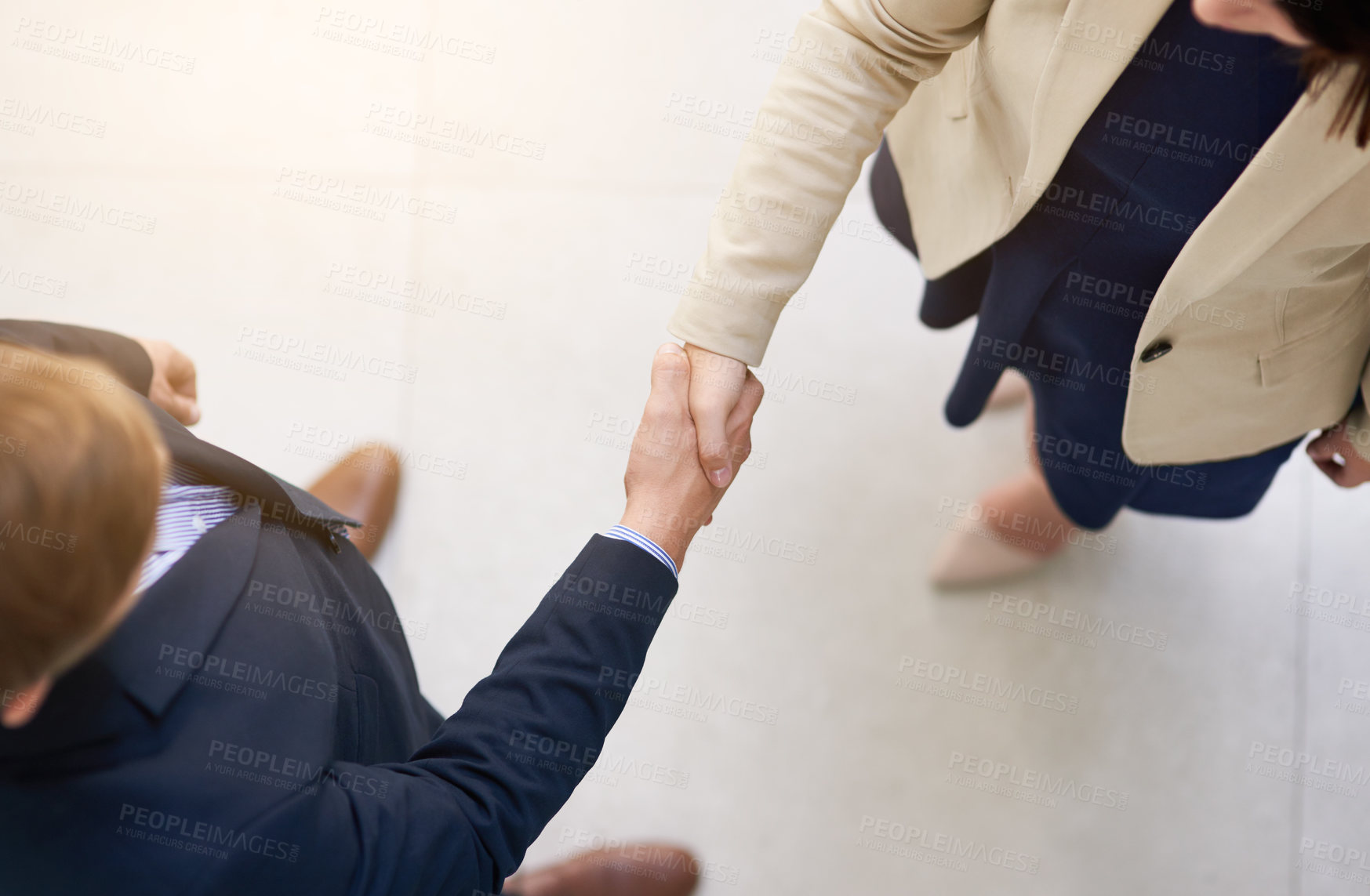 Buy stock photo Shot of two businesspeople shaking hands