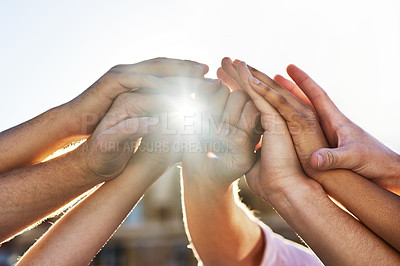 Buy stock photo Shot of a group of hands holding on to each other