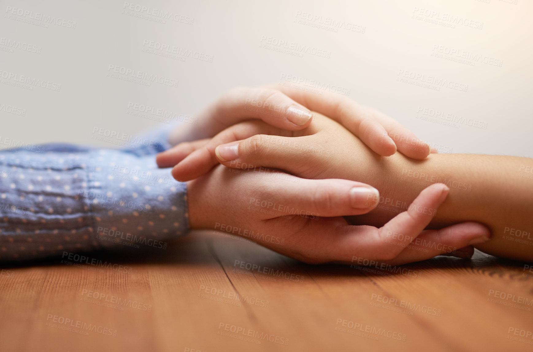 Buy stock photo Empathy, support and people holding hands in house with comfort, loyalty or kindness on wall background. Love, understanding and friends in solidarity with prayer for guide, strength or understanding