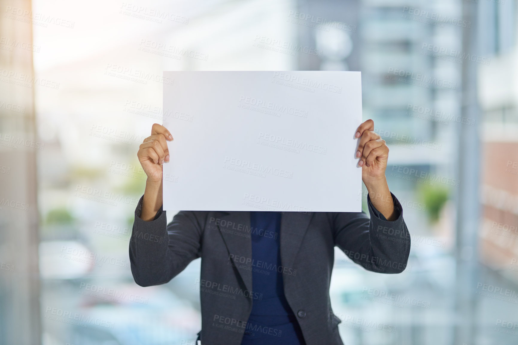 Buy stock photo Shot of a businesswoman holding up a blank placard