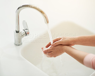 Buy stock photo Tap, water and hands for hygiene, skincare and cleaning or bacteria disinfection in house by kitchen sink. Faucet, woman and washing palms in home with soap for virus, dirt and health or self care