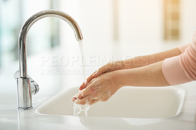 Buy stock photo Shot of hands being washed at a tap