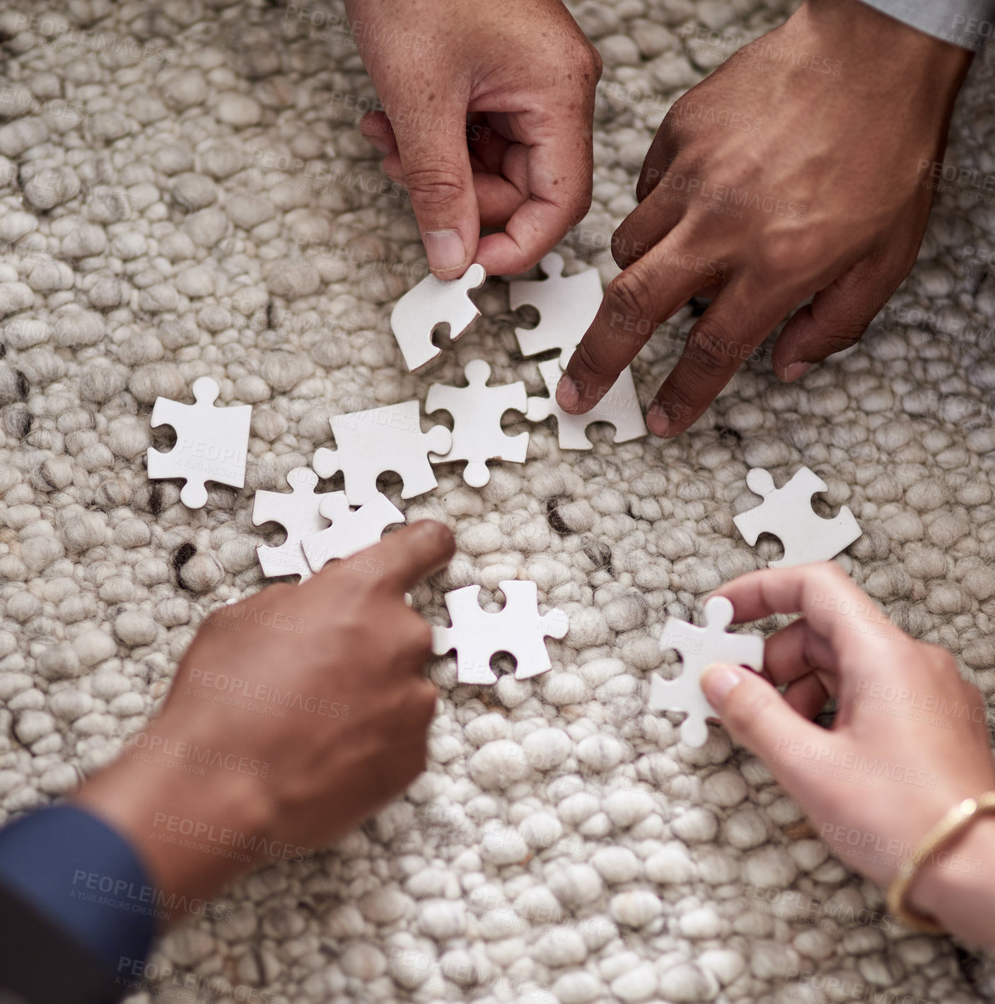 Buy stock photo Cropped shot of a group of people fitting puzzle pieces together