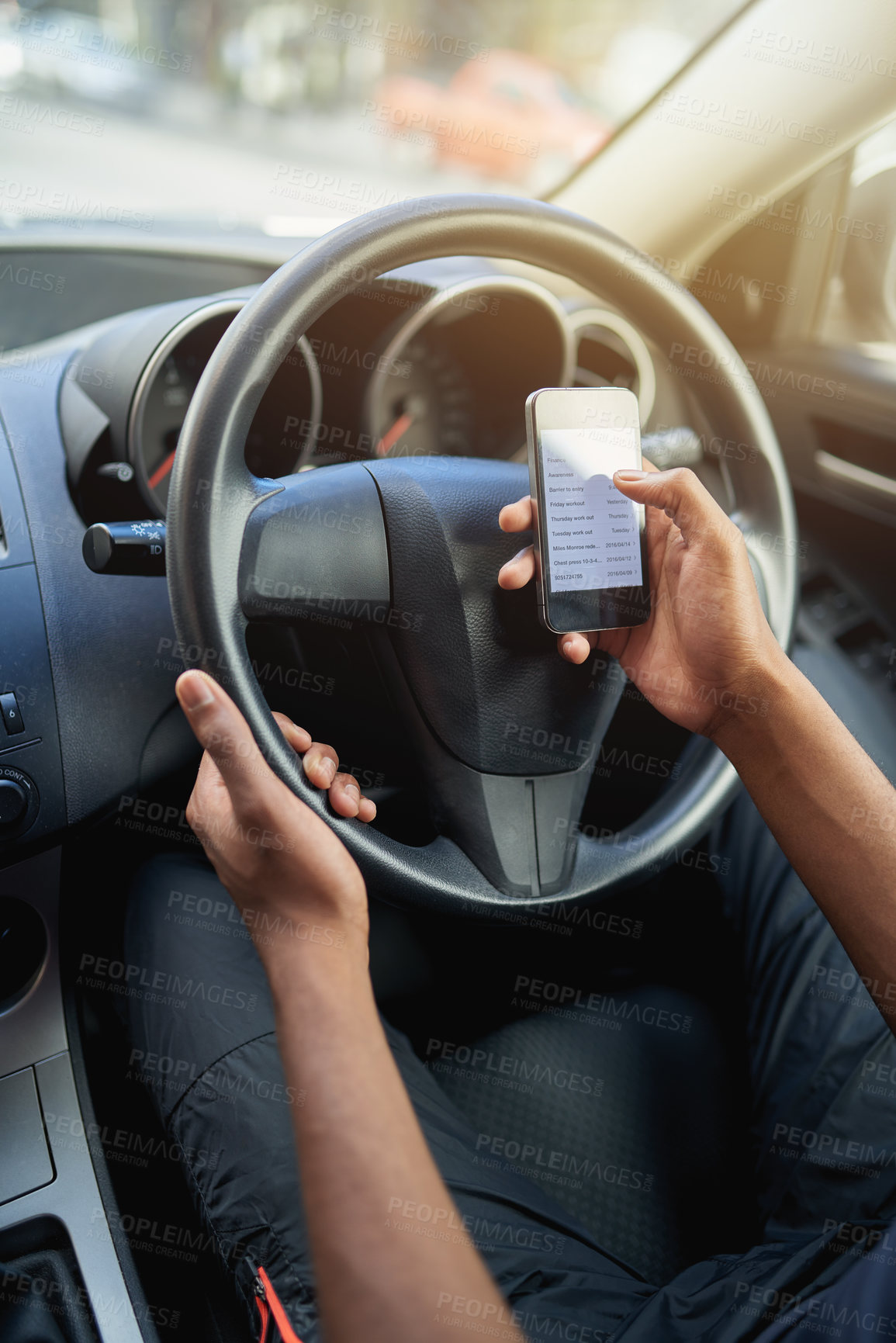 Buy stock photo Phone, texting and driving with hands of driver on steering wheel with scroll, danger and risk. Road safety, awareness and person in car with smartphone, distraction and attention with auto insurance