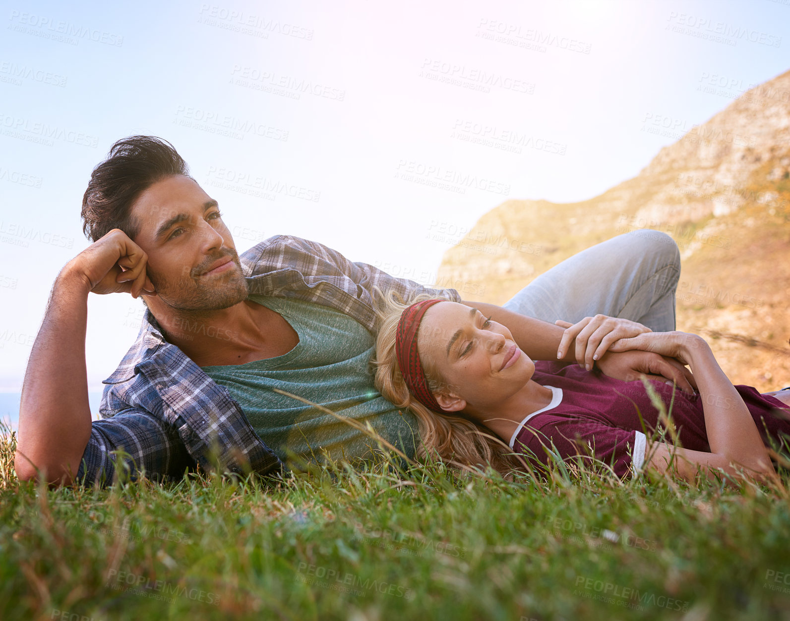 Buy stock photo Relax, smile and love with couple in nature for mountains, bonding and affectionate. Happiness, date and romance with man and woman cuddle in grass field for summer break, happy and relationship