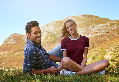 Buy stock photo Shot of an affectionate young couple enjoying a day outdoors