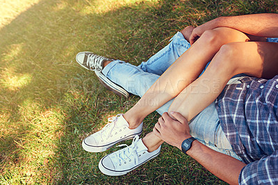 Buy stock photo Shot of an affectionate young couple enjoying a day outdoors