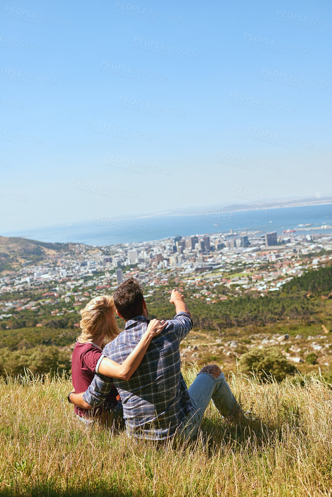 Buy stock photo Shot of an affectionate young couple enjoying a day outdoors