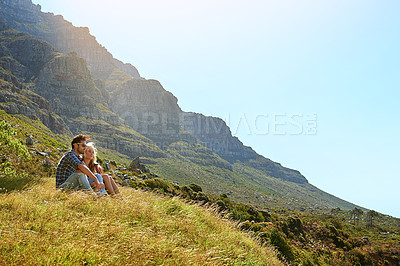 Buy stock photo Shot of an affectionate young couple enjoying a day outdoors