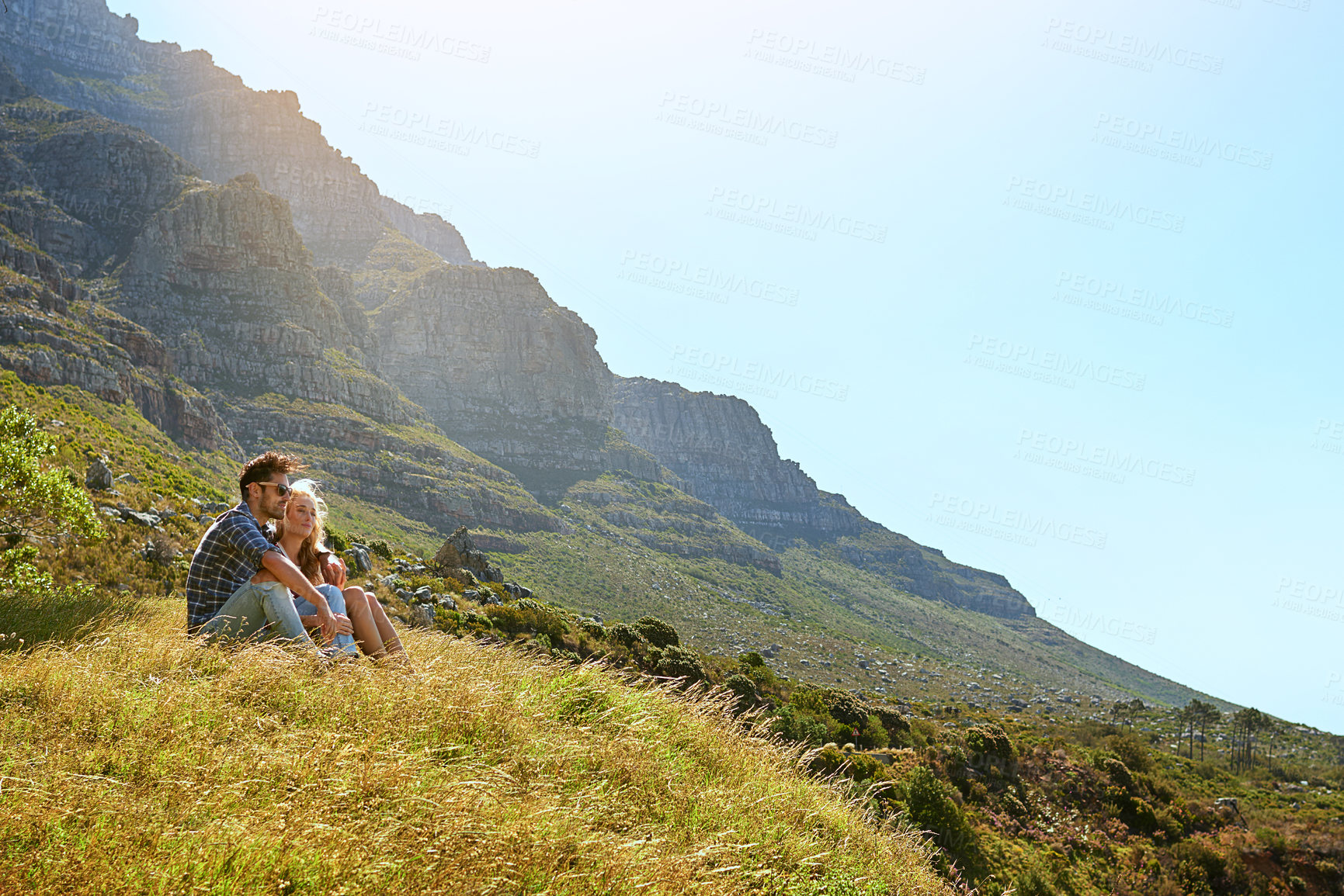 Buy stock photo View, smile and love with couple in nature for bonding, park conservation date and mountain space. Happiness, holiday and peace with man and woman in grass field for vacation, commitment and trust