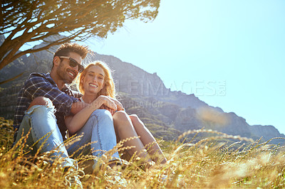 Buy stock photo Summer, smile and love with couple in nature for bonding, park conservation date and mountain view. Happiness, holiday and peace with man and woman in grass field for vacation, commitment and space