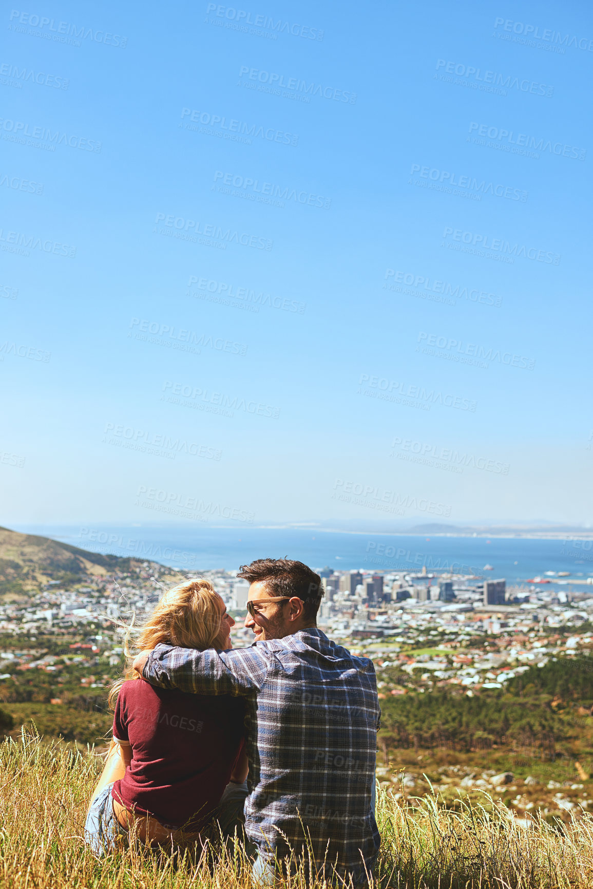 Buy stock photo Back, relax and love with couple in nature for bonding, park conservation date and mountain view. Happiness, holiday and blue sky with man and woman in grass field for vacation, commitment and space