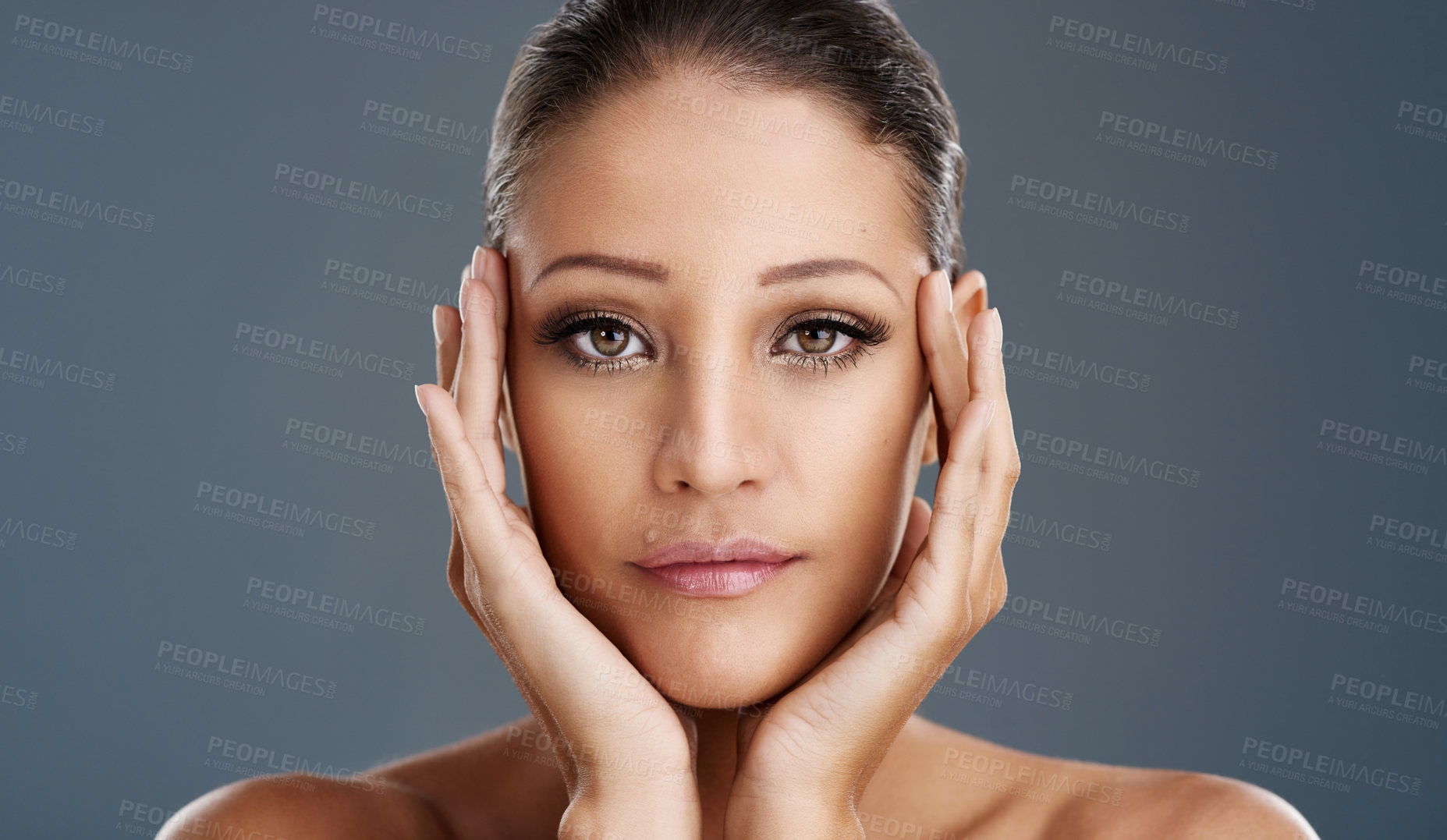 Buy stock photo Cropped shot of a beautiful young woman posing in the studio