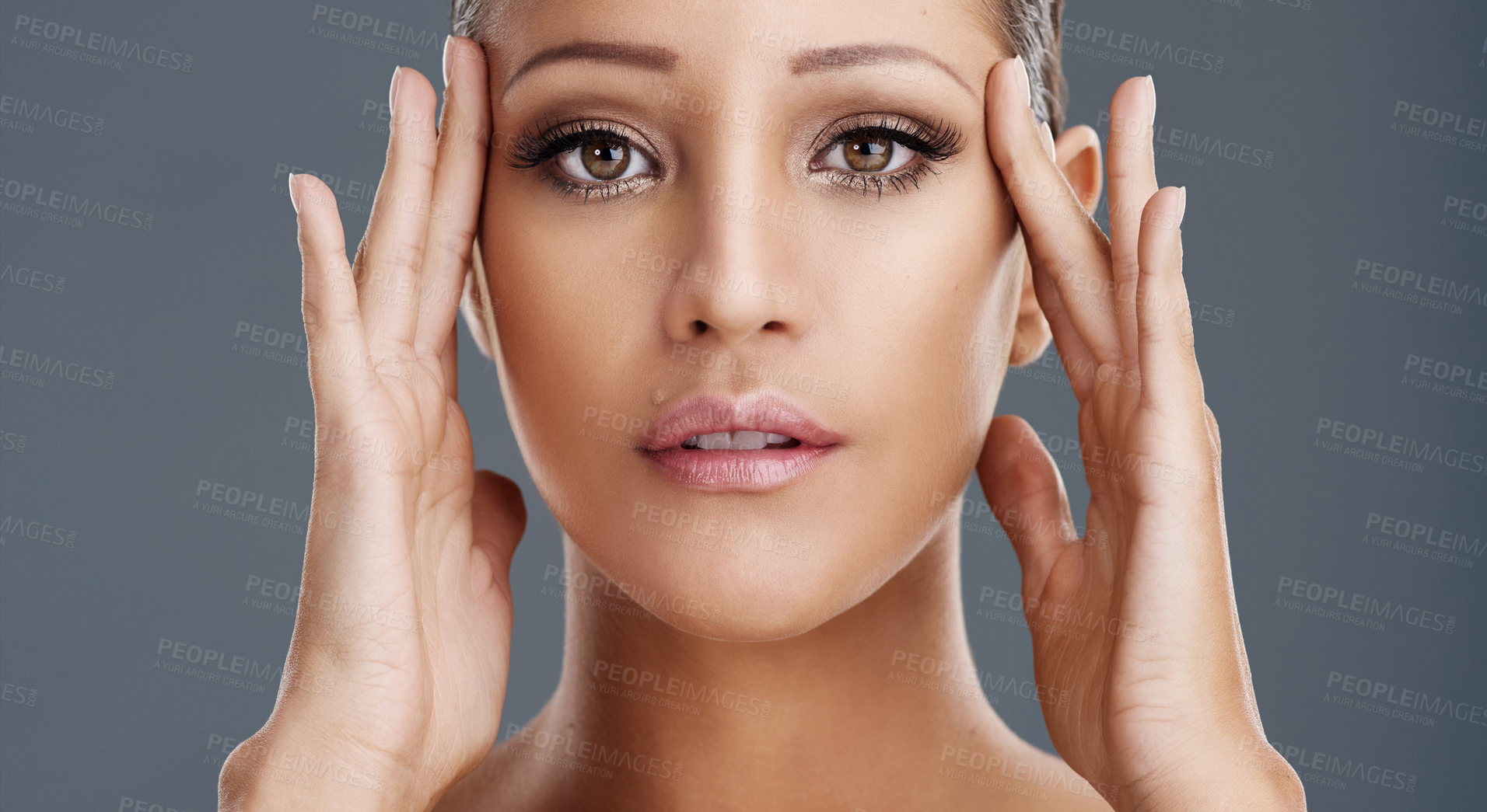 Buy stock photo Cropped shot of a beautiful young woman posing in the studio