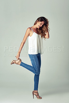Buy stock photo Happy, woman and denim for fashion in studio with stylish, glamour and elegant by posing in heels. Confident, female person and creative clothing with attractive beauty poses on white background