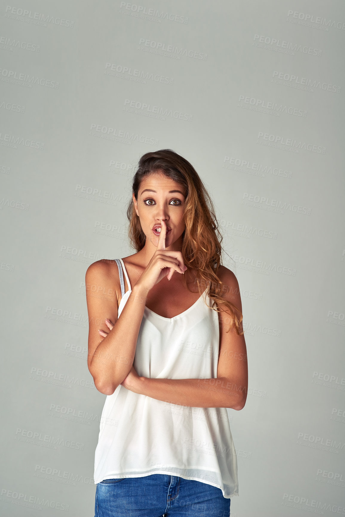 Buy stock photo Portrait, woman and secret with finger on lips in studio for hush, news or quiet sign isolated on a white background mockup space. Hand, gesture and silence for confidential, privacy or whisper emoji