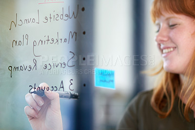 Buy stock photo Happy woman, brainstorming or writing ideas on glass board or sticky note, planning in office. Creative project, agenda or designer in startup for working, strategy and storyboard with goals or smile
