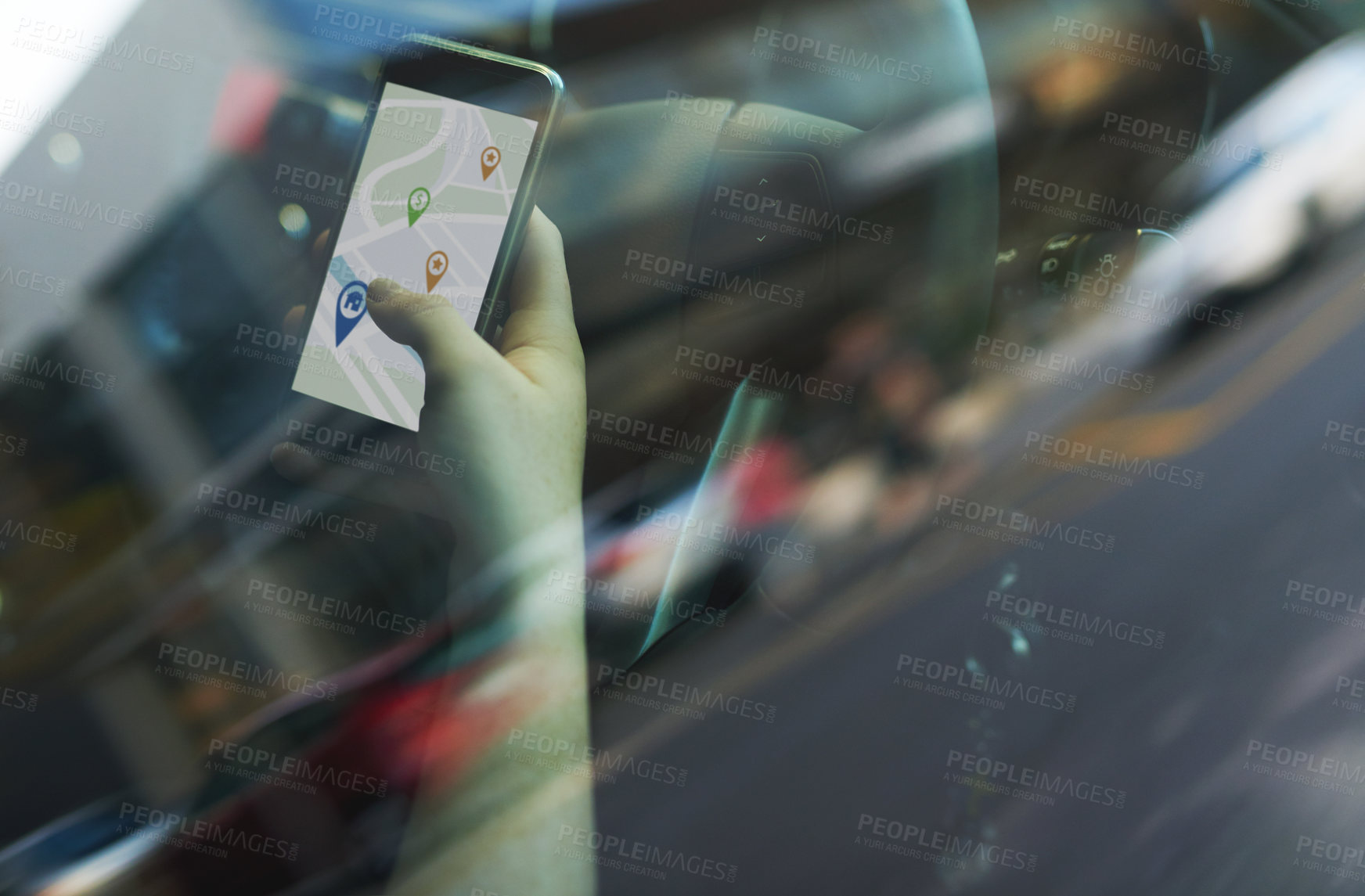 Buy stock photo Cropped shot of a woman using her phone's gps while driving