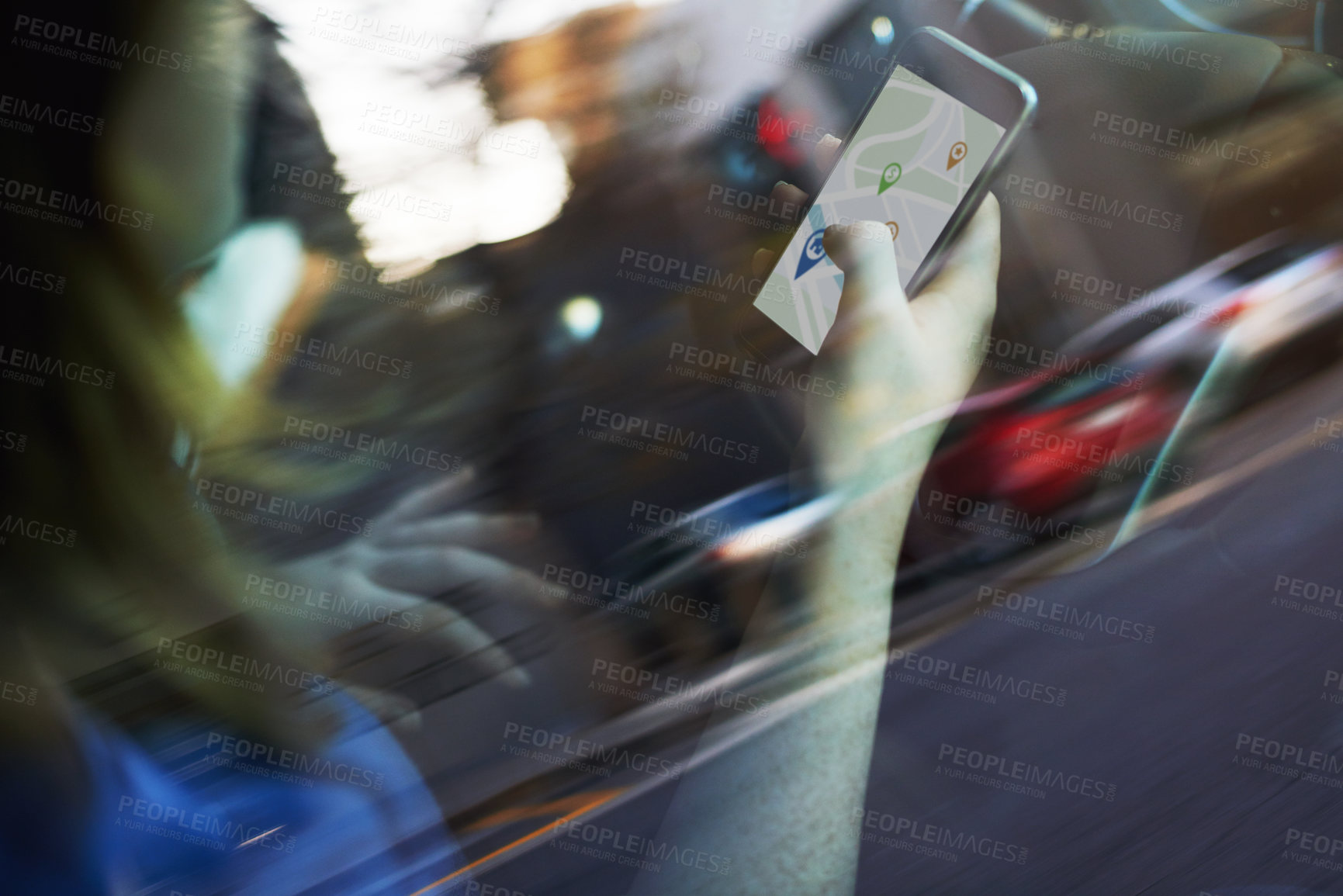Buy stock photo Cropped shot of a woman using her phone's gps while driving