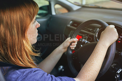 Buy stock photo Girl, travel and drive car for transport or road trip, steering wheel and serious in morning for journey to work. Woman, vehicle and driving for transportation or commute to job, automotive and park.