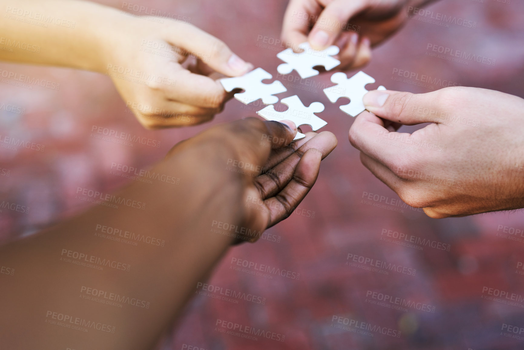 Buy stock photo Shot of hands putting puzzle pieces together
