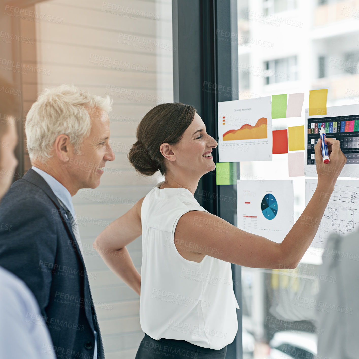 Buy stock photo Shot of a woman giving a presentation to colleagues in an office