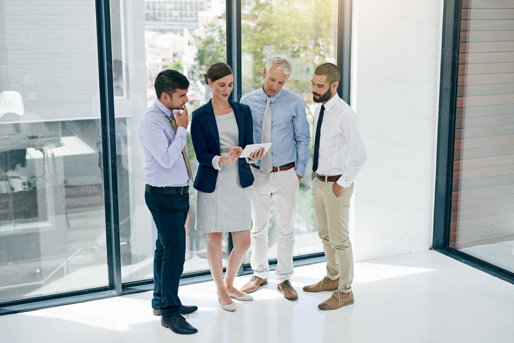 Buy stock photo Collaboration, management and tablet with business people in office together for discussion or planning. Conversation, meeting or teamwork with employee men and women in workplace for feedback