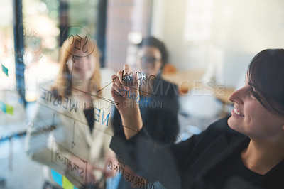 Buy stock photo Shot of businesswomen brainstorming in an office