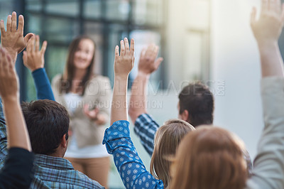 Buy stock photo Woman speaker at conference, group of people with hands up for question or answer at training presentation or meeting. Feedback, opinion and ideas, men and women at seminar, hand in air and questions